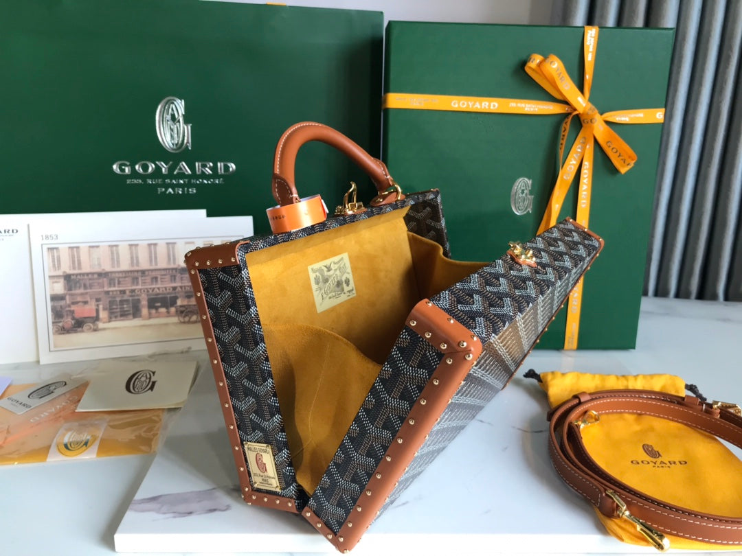 GRAND HÔTEL TRUNK BAG 24 IN BLACK GOYARDINE CANVAS AND TAN CALFSKIN