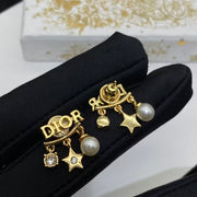 CD DioRevolution Earrings Gold-Finish Metal