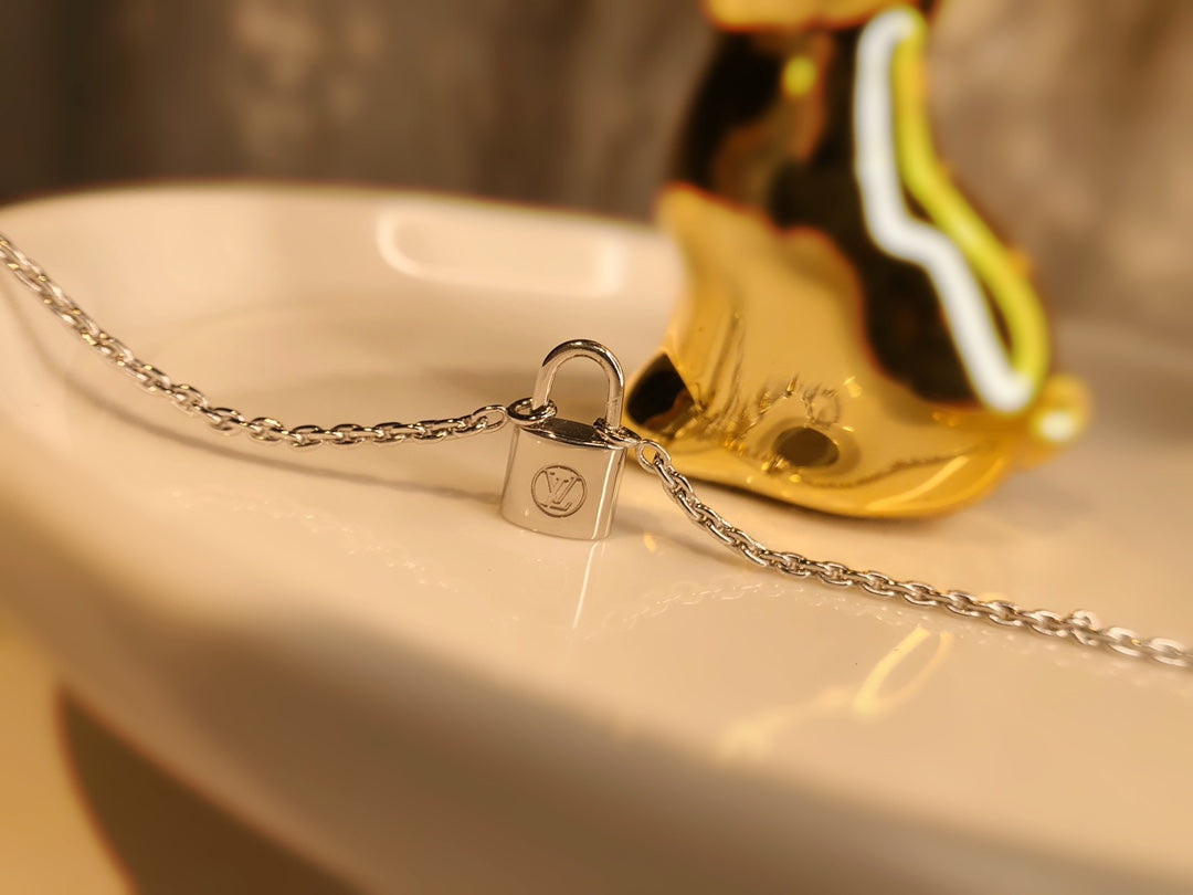 LV CHARITY LOCK NECKLACE