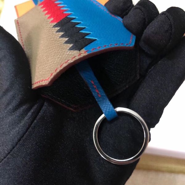 HM Clochette Cles Grand Tressage Charm In Taupe And Blue