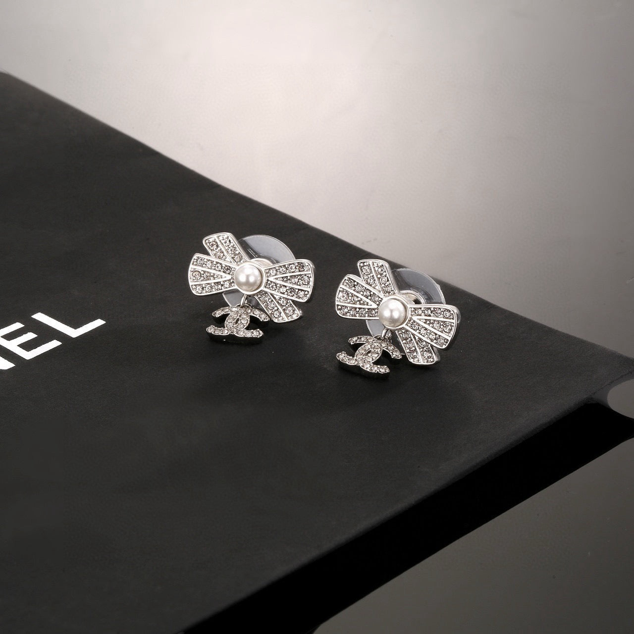 CC Double C Bow Sliver Diamond Pearl Earrings
