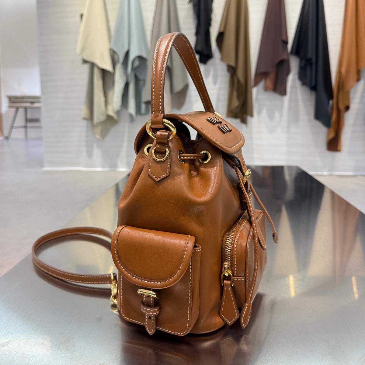 MiuMiu 2026 Buckle Gold Backpack Leather